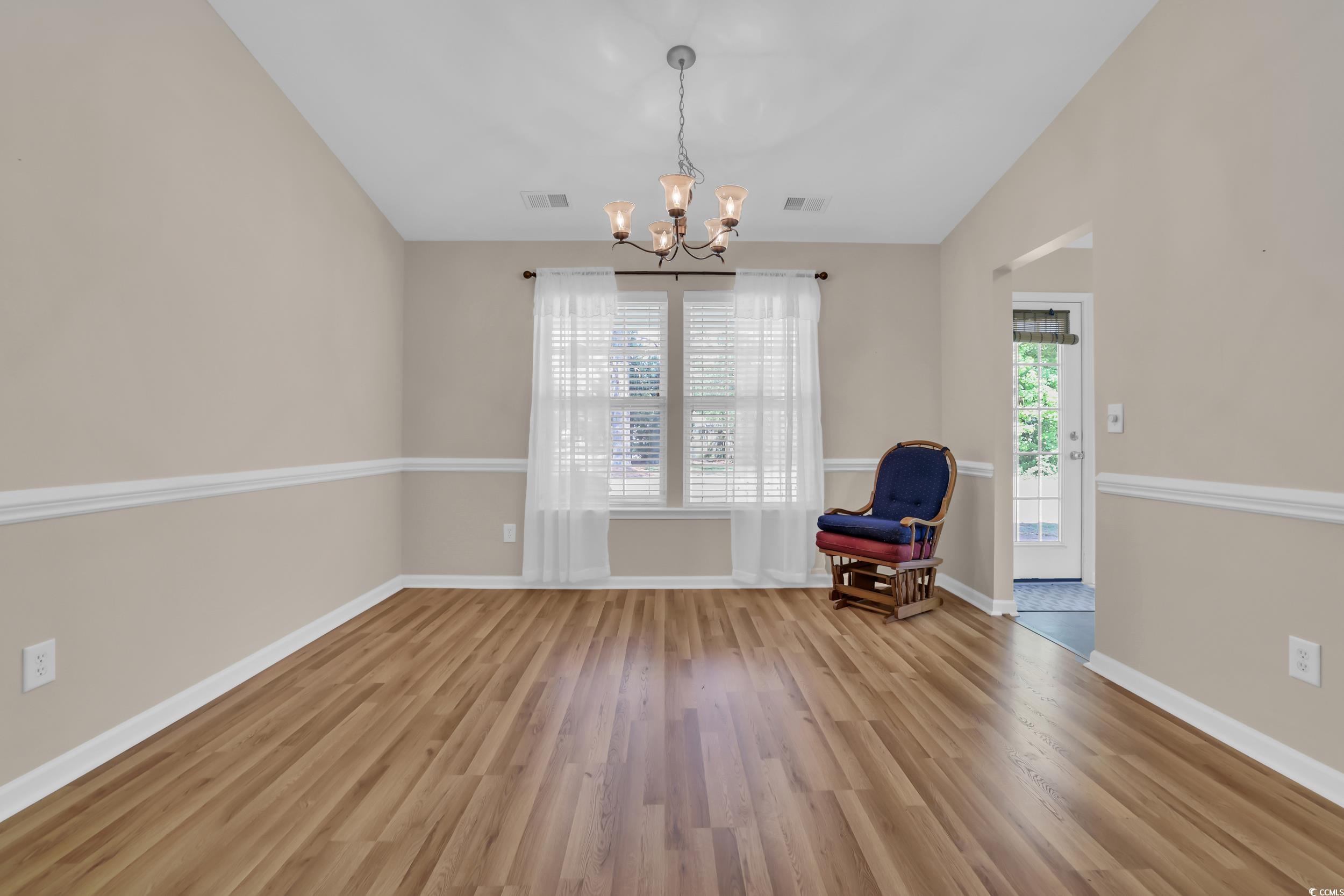 244 Devonbrook Place Longs, SC 29568 - Photo 11 of 40 Unfurnished room with visible vents, wood finished