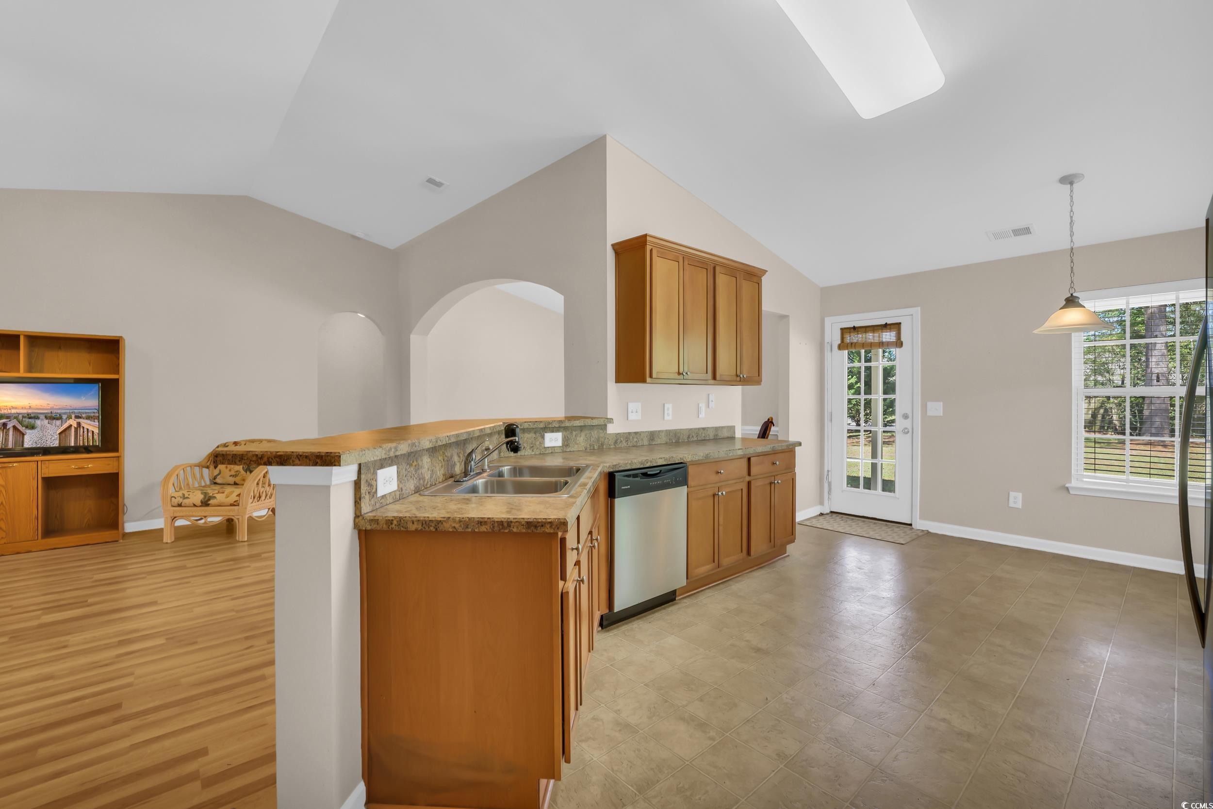 244 Devonbrook Place Longs, SC 29568 - Photo 14 of 40 Kitchen with dishwasher, lofted ceiling, a healthy