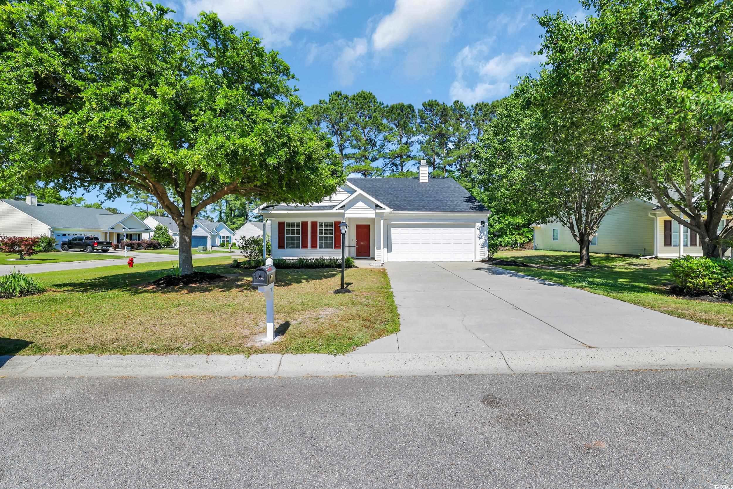 View of front of property with an attached garage,