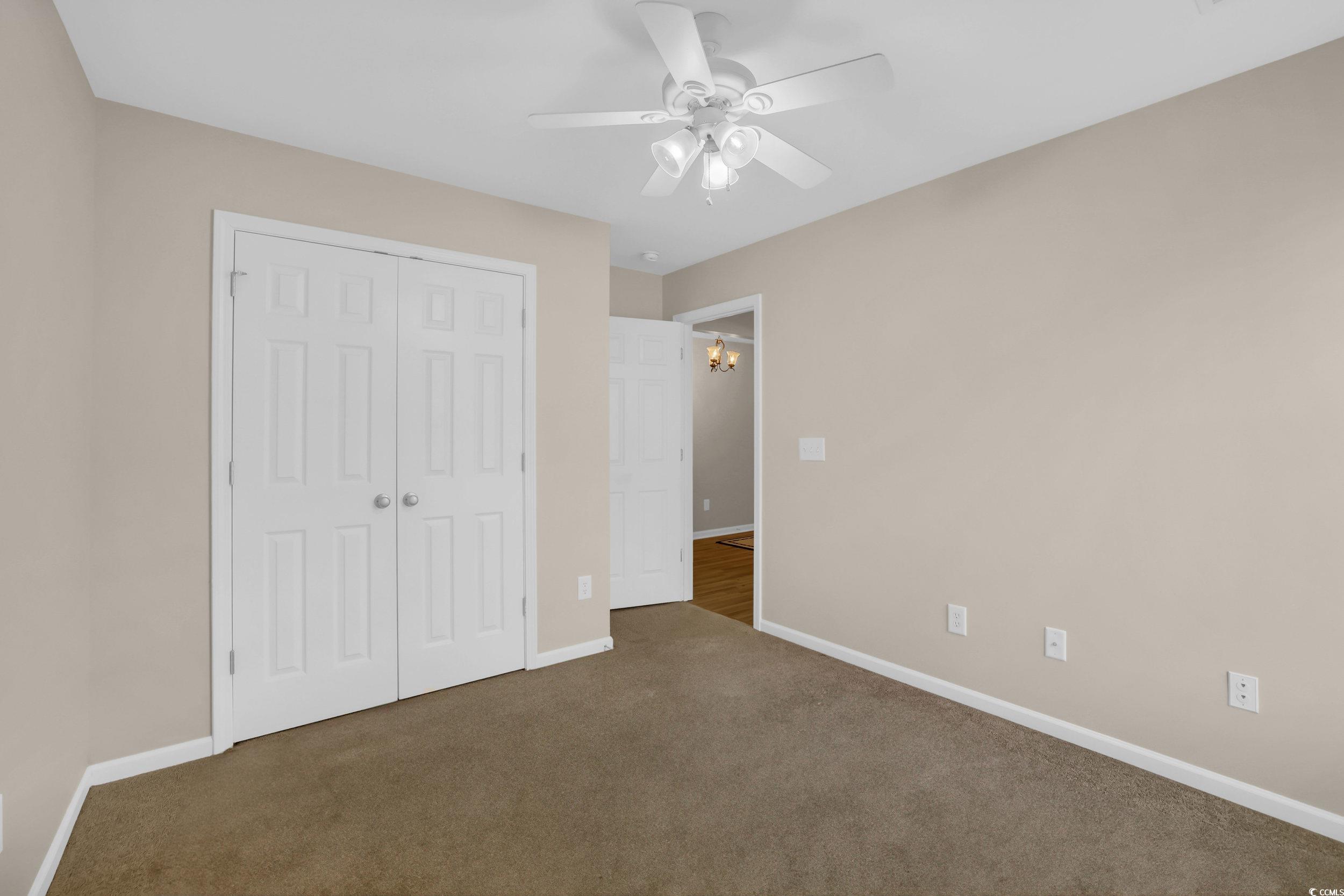 244 Devonbrook Place Longs, SC 29568 - Photo 29 of 40 Unfurnished bedroom featuring carpet, a closet, ba
