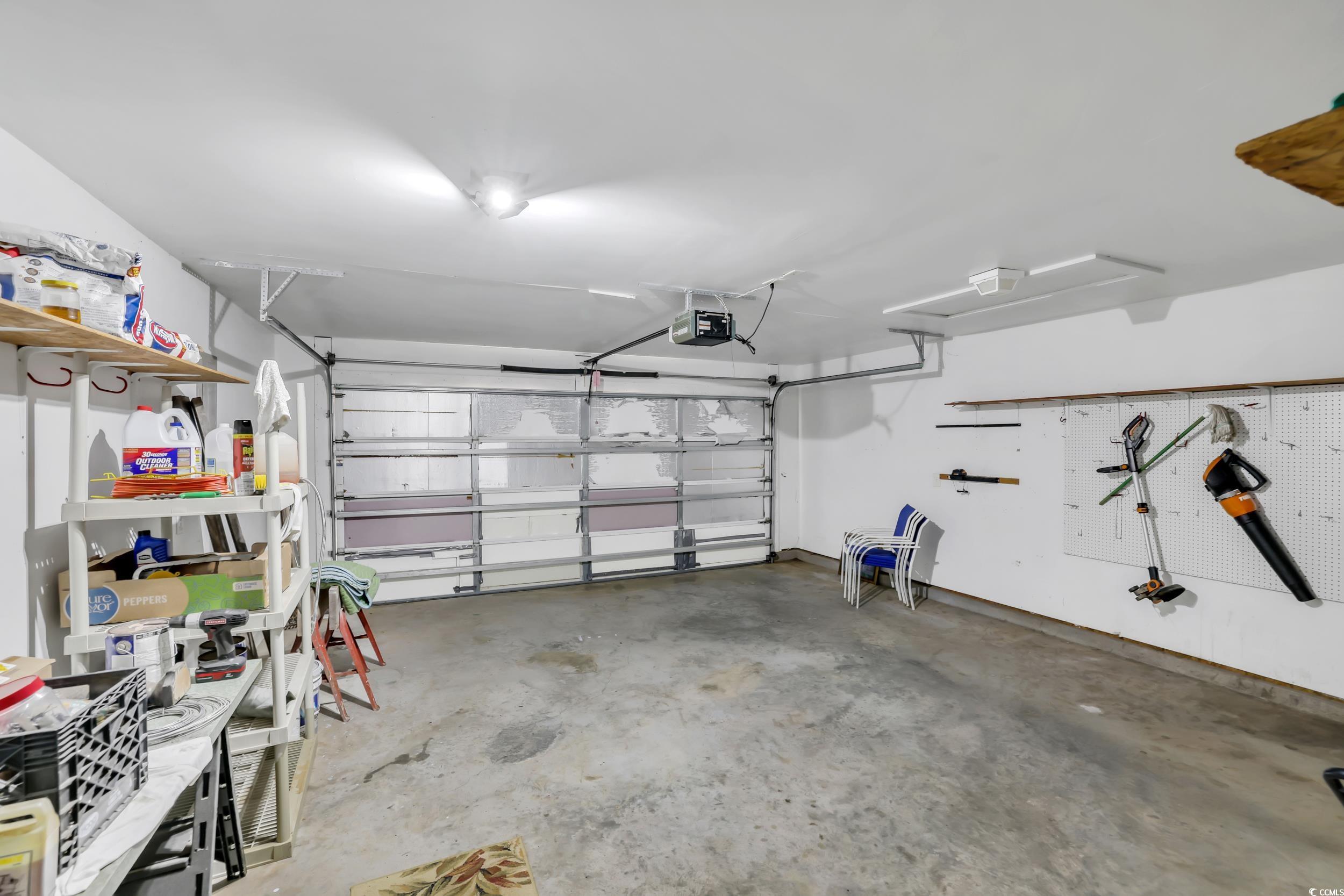 244 Devonbrook Place Longs, SC 29568 - Photo 35 of 40 Garage with a garage door opener