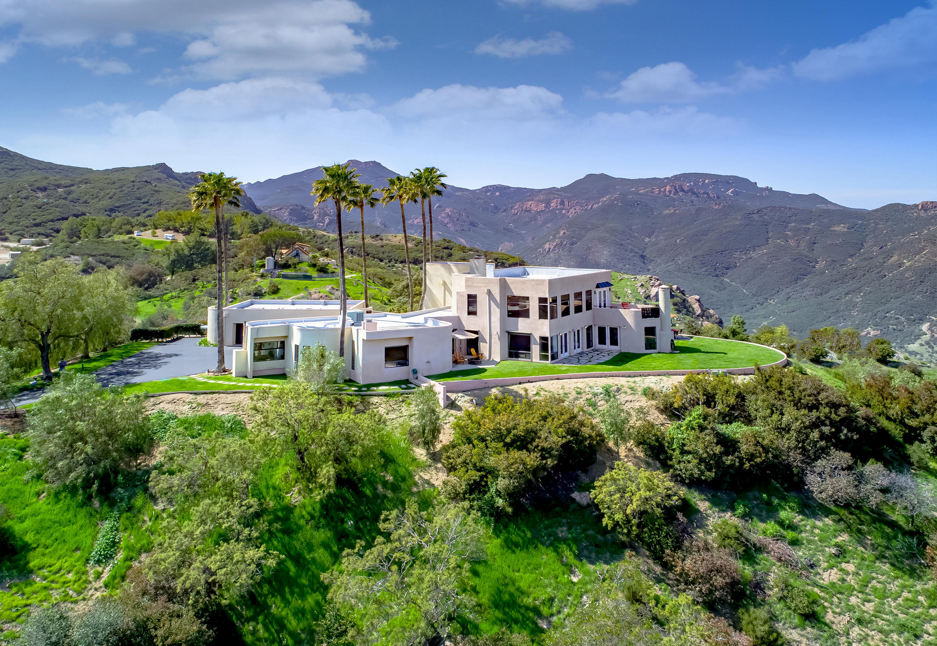 aerial view of a house with a garden