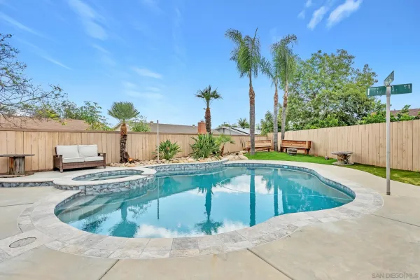 a view of a swimming pool with a lounge chair
