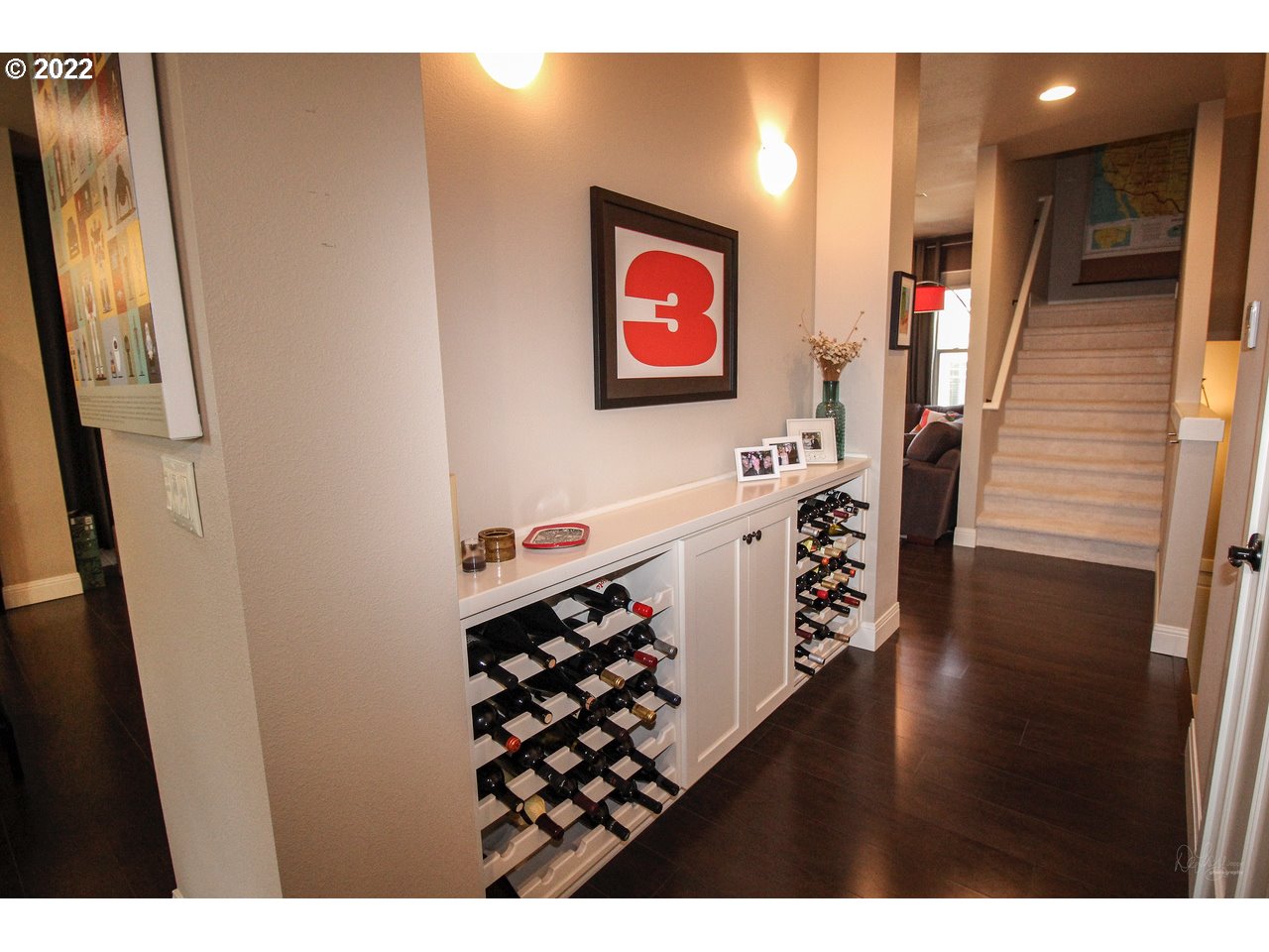 14174 Southwest Compass Drive Beaverton, OR 97005 - Photo 12 of 32 a view of a hallway with wooden floor and stairs