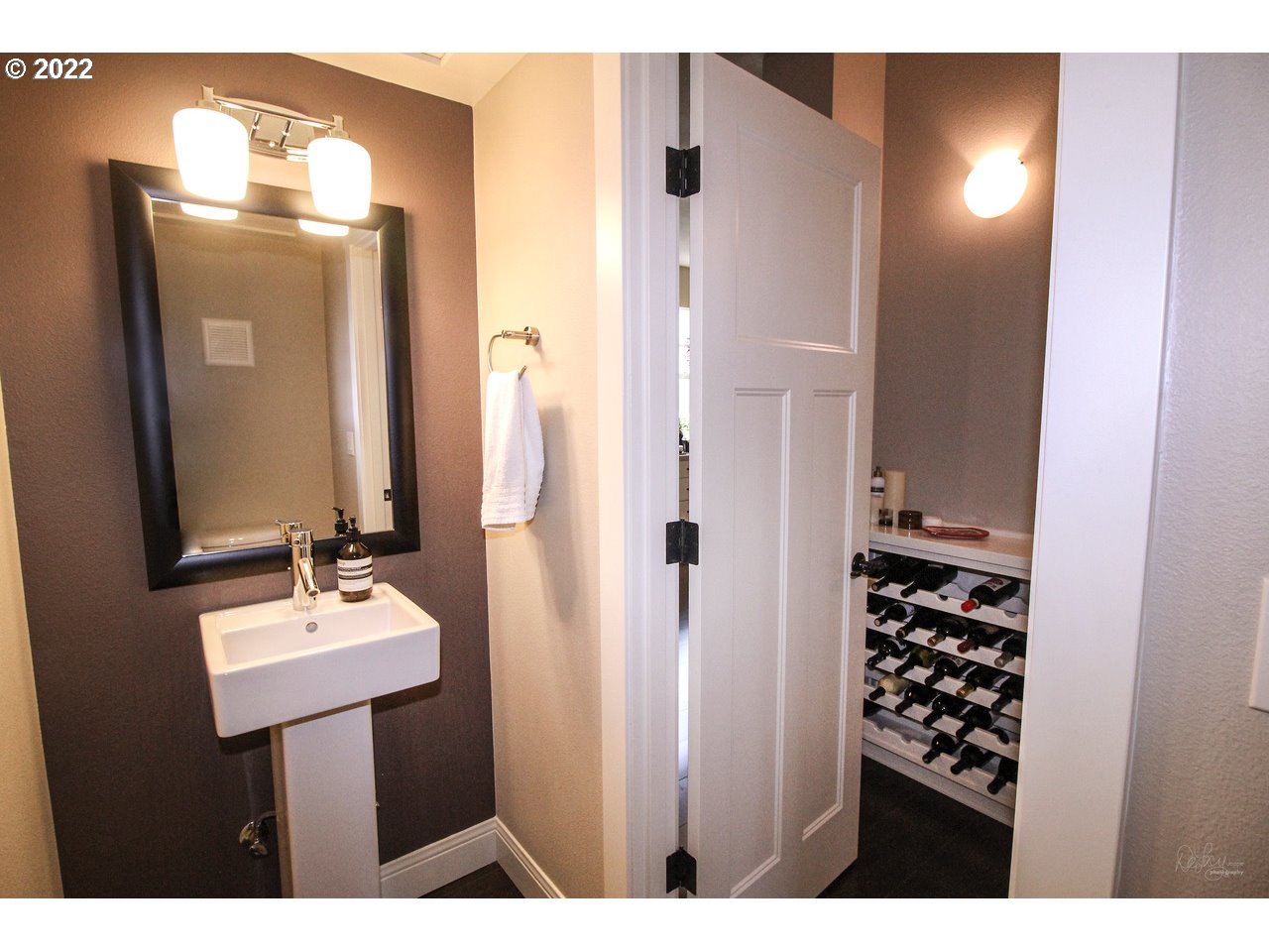 14174 Southwest Compass Drive Beaverton, OR 97005 - Photo 13 of 32 a bathroom with a sink a mirror and a shower