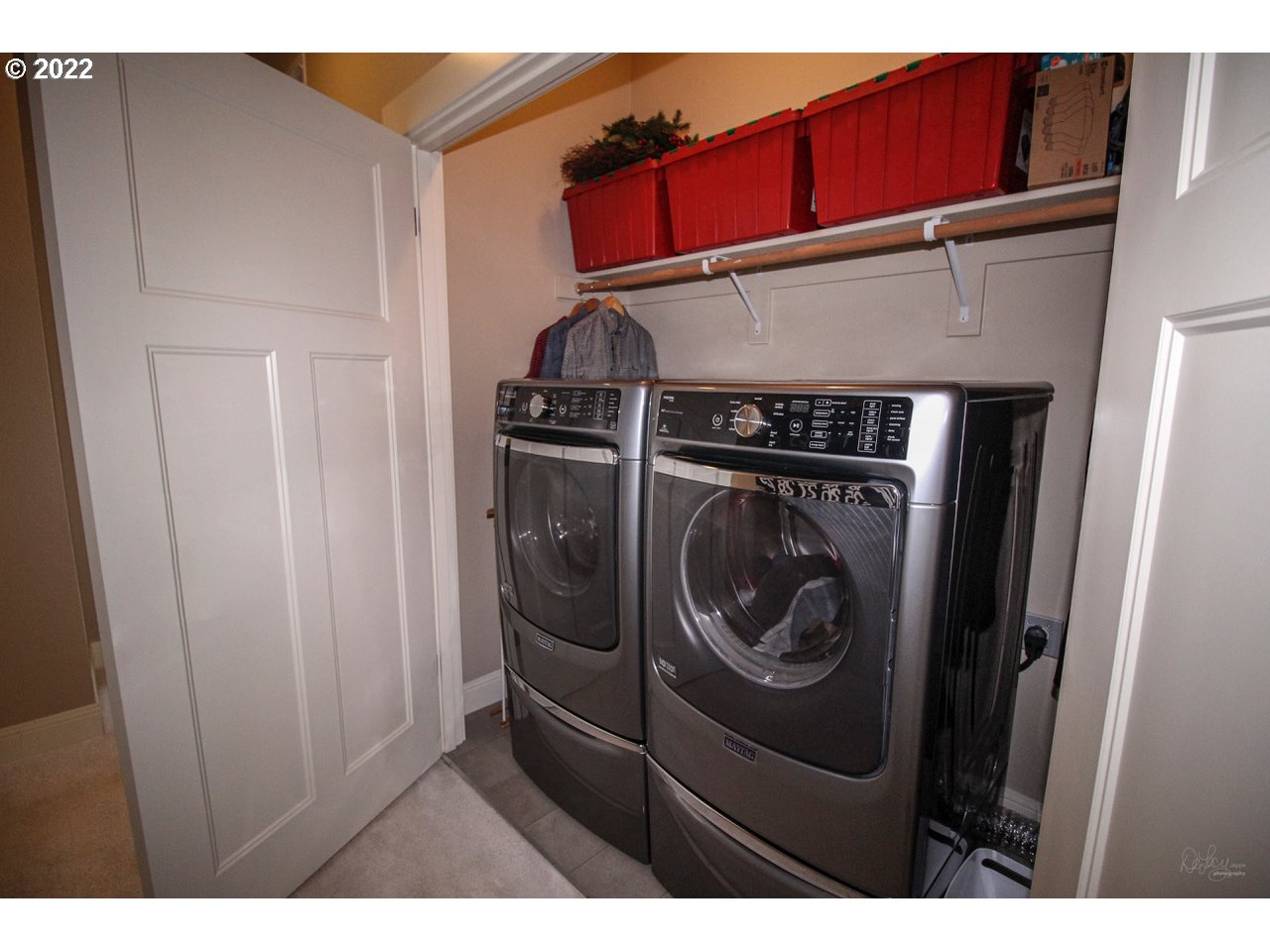 14174 Southwest Compass Drive Beaverton, OR 97005 - Photo 15 of 32 a utility room with dryer and washer