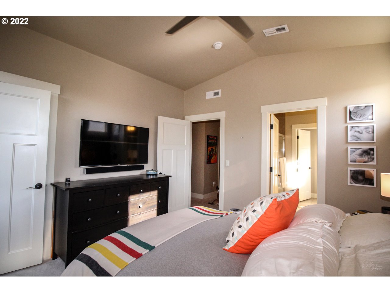 14174 Southwest Compass Drive Beaverton, OR 97005 - Photo 17 of 32 a bedroom with a bed and a television in it