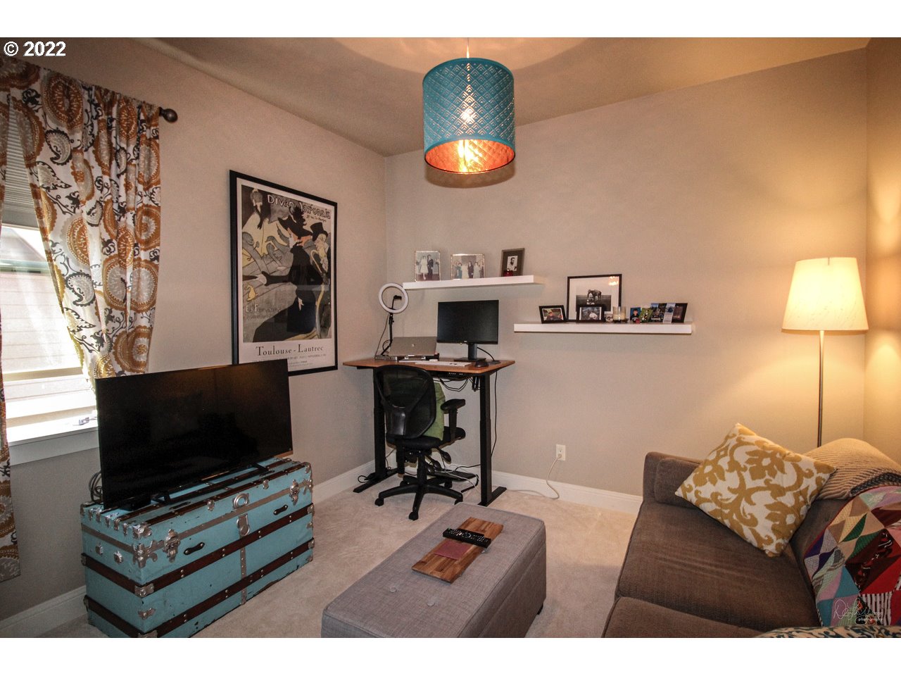 14174 Southwest Compass Drive Beaverton, OR 97005 - Photo 19 of 32 a living room with furniture and a flat screen tv