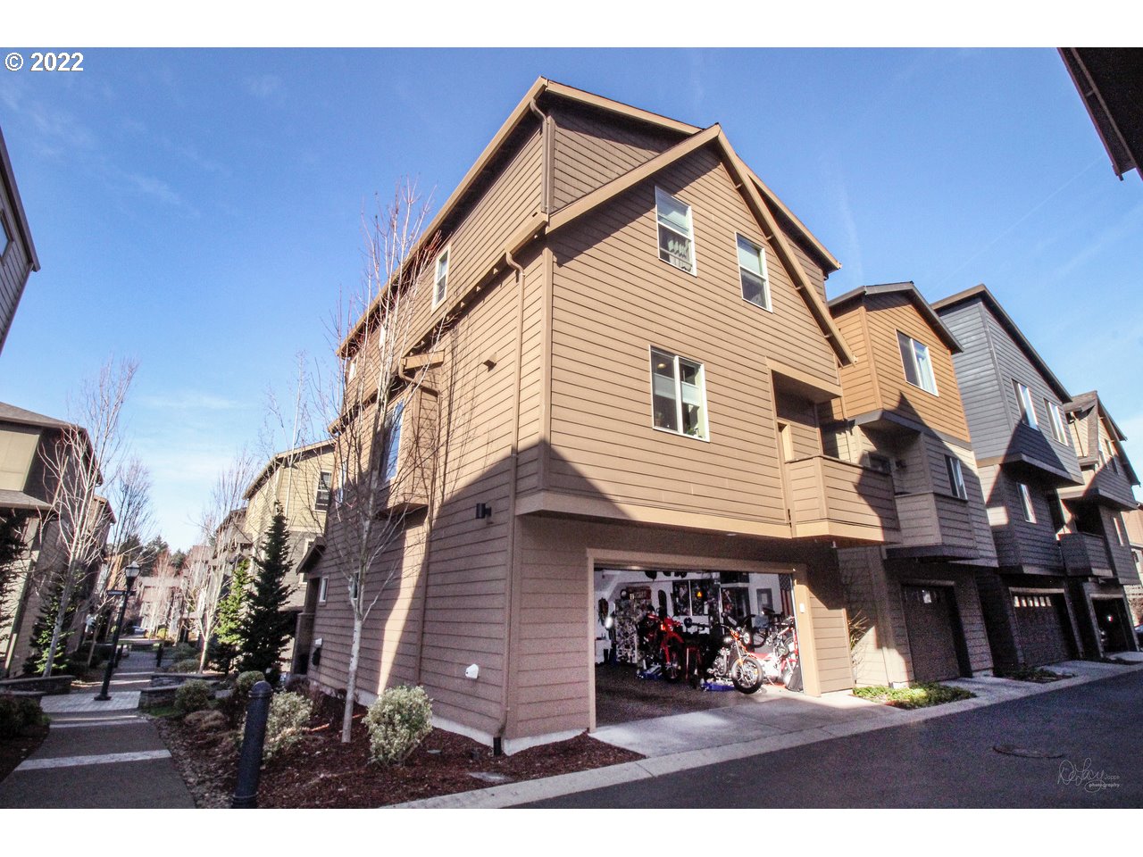 14174 Southwest Compass Drive Beaverton, OR 97005 - Photo 24 of 32 a front view of a house with a balcony