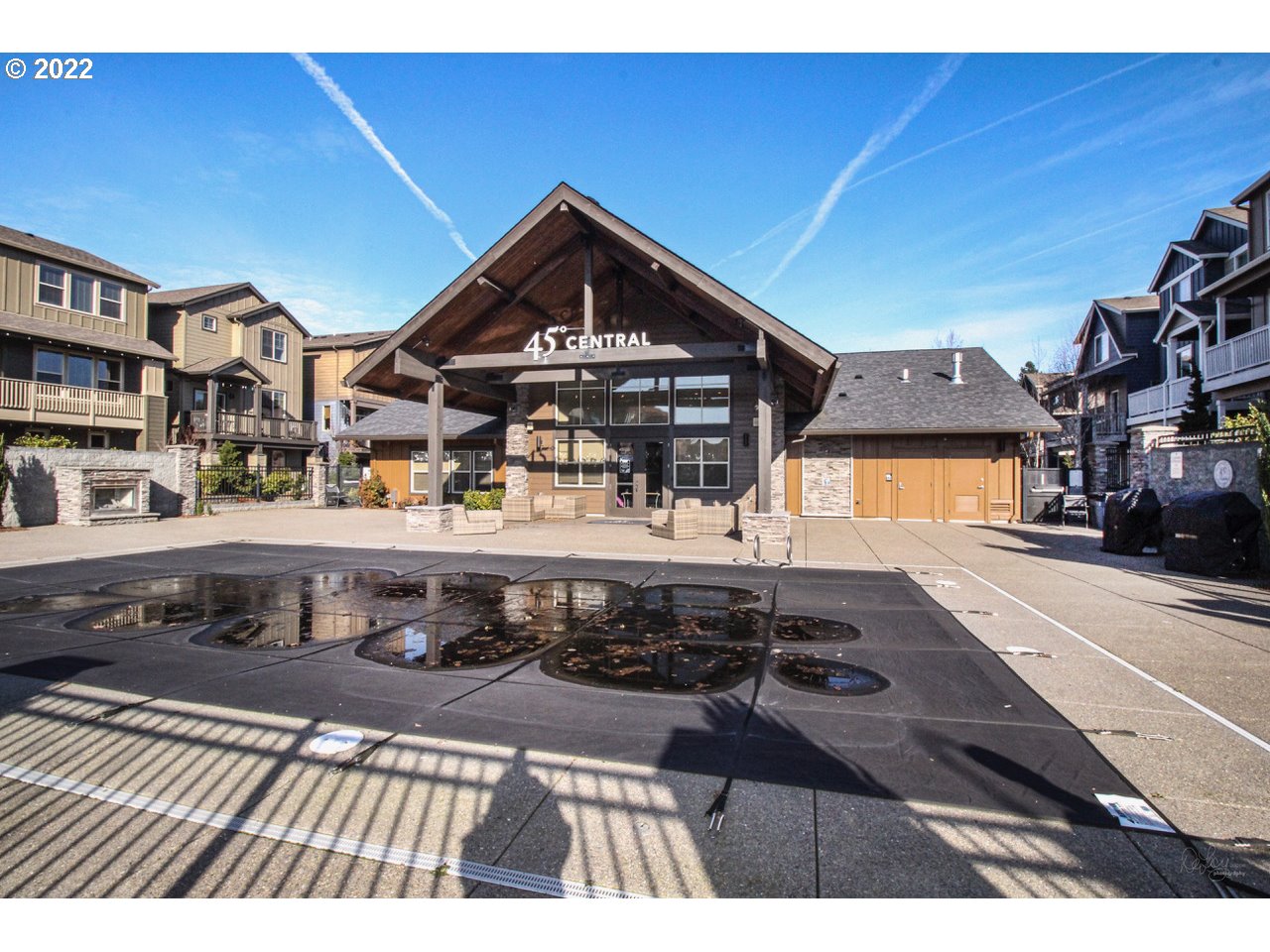 14174 Southwest Compass Drive Beaverton, OR 97005 - Photo 26 of 32 a view of a brick house with many windows