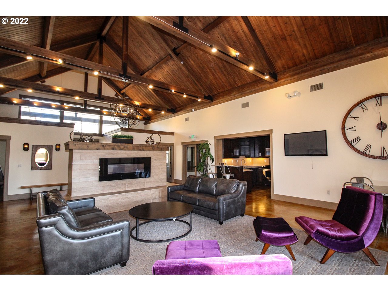 14174 Southwest Compass Drive Beaverton, OR 97005 - Photo 27 of 32 a living room with furniture and a flat screen tv