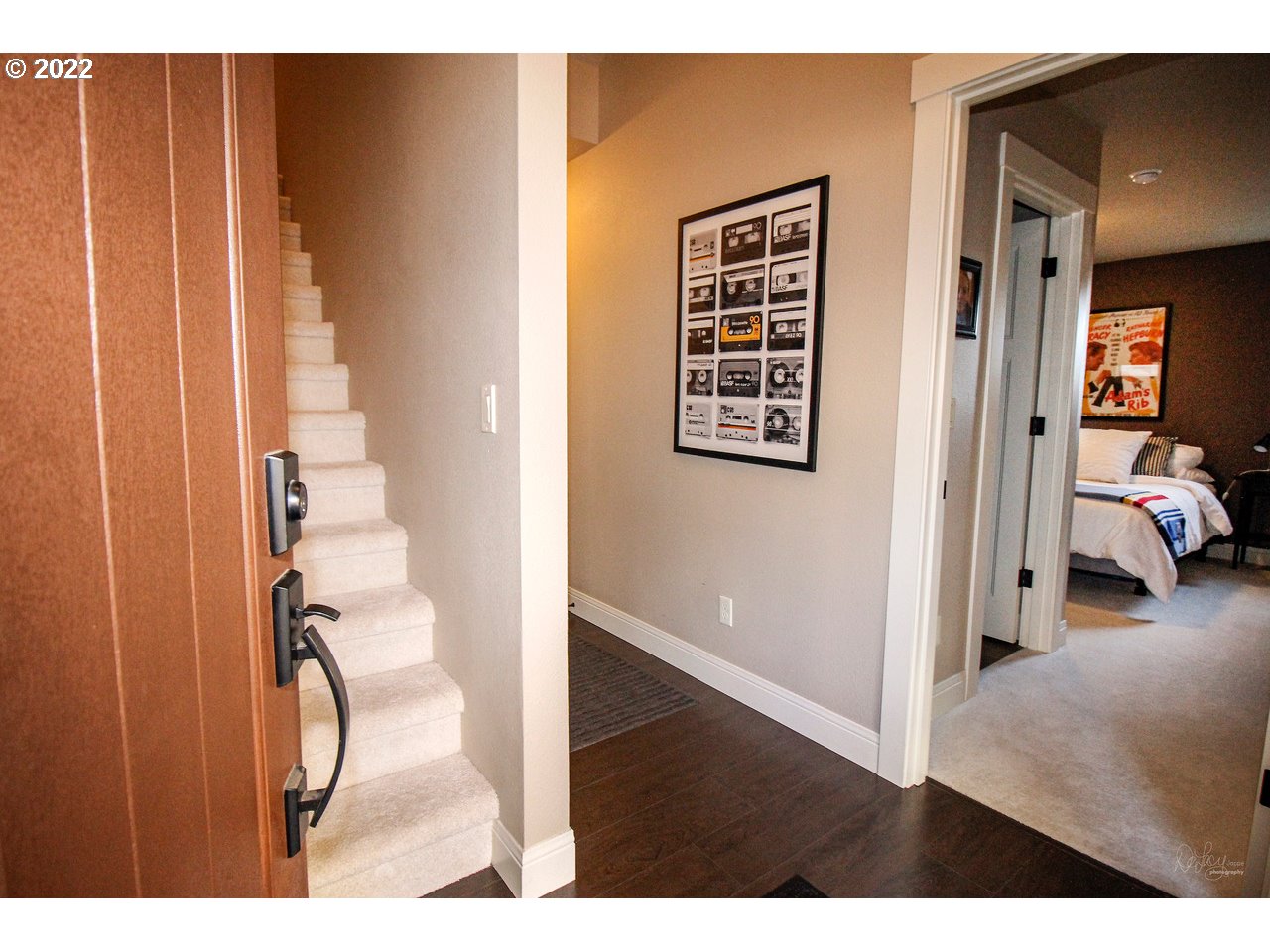 14174 Southwest Compass Drive Beaverton, OR 97005 - Photo 3 of 32 a view of a bedroom with wooden floor and windows