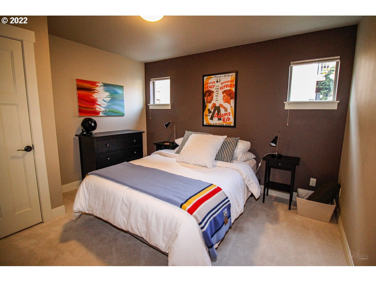 14174 Southwest Compass Drive Beaverton, OR 97005 - Photo 4 of 32 a bedroom with a bed and dresser with mirror