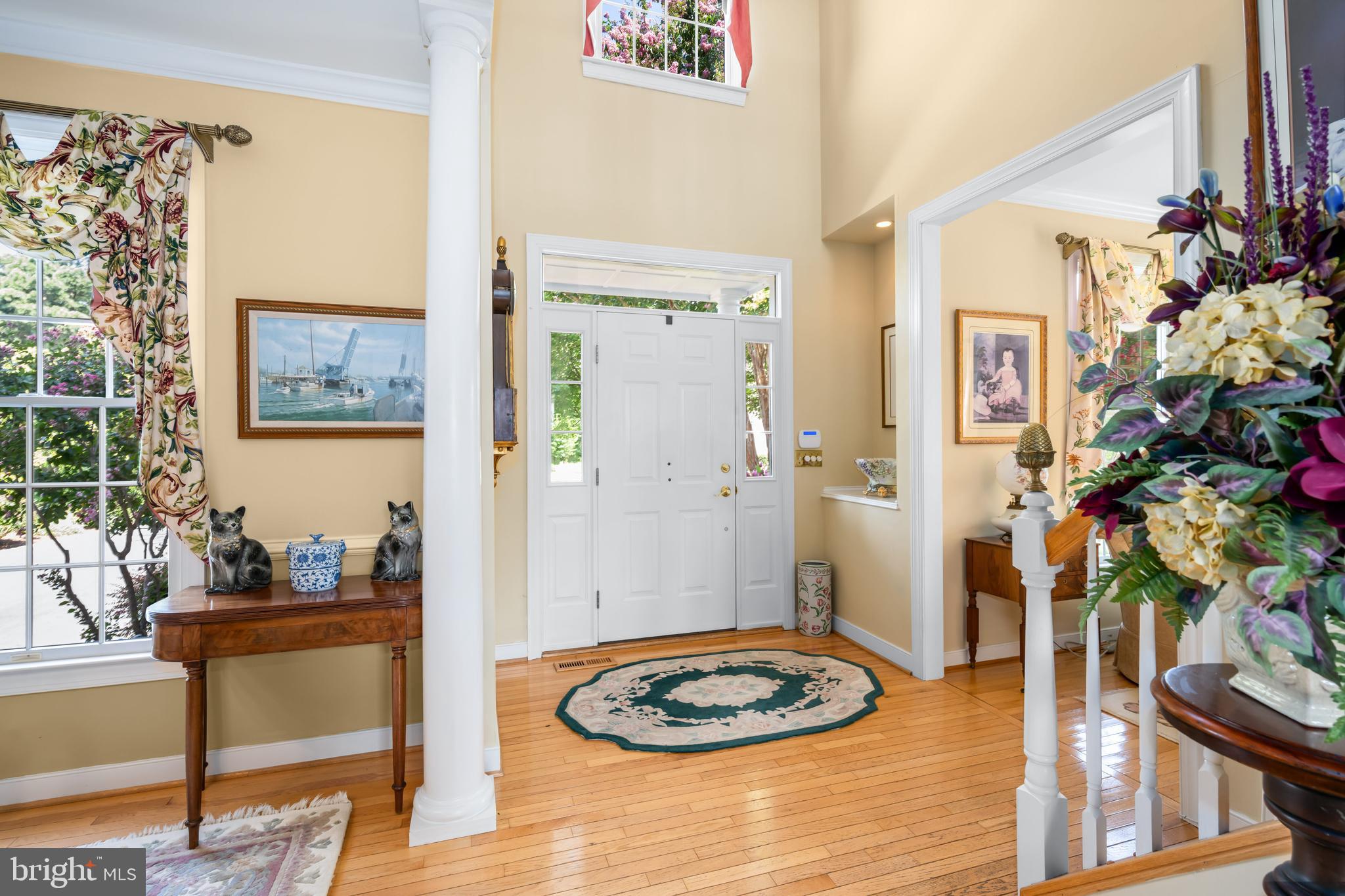 21477 Island Club Road Tilghman, MD 21671 - Photo 19 of 50 a view of a livingroom with furniture and a potted plant
