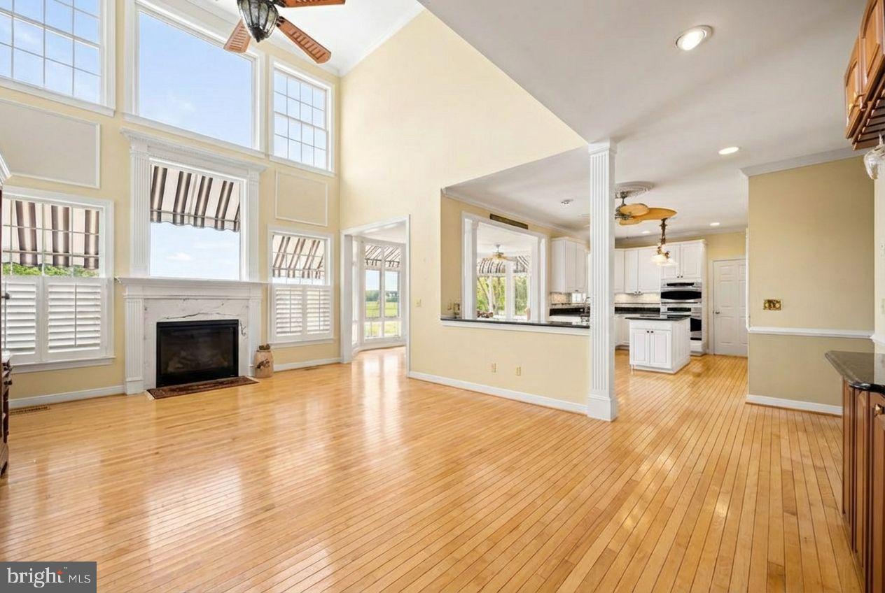 21477 Island Club Road Tilghman, MD 21671 - Photo 24 of 50 a view of a living room kitchen with stainless steel appliances wooden floor and a large window