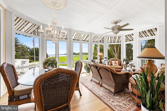 a living room with furniture a chandelier and a chandelier