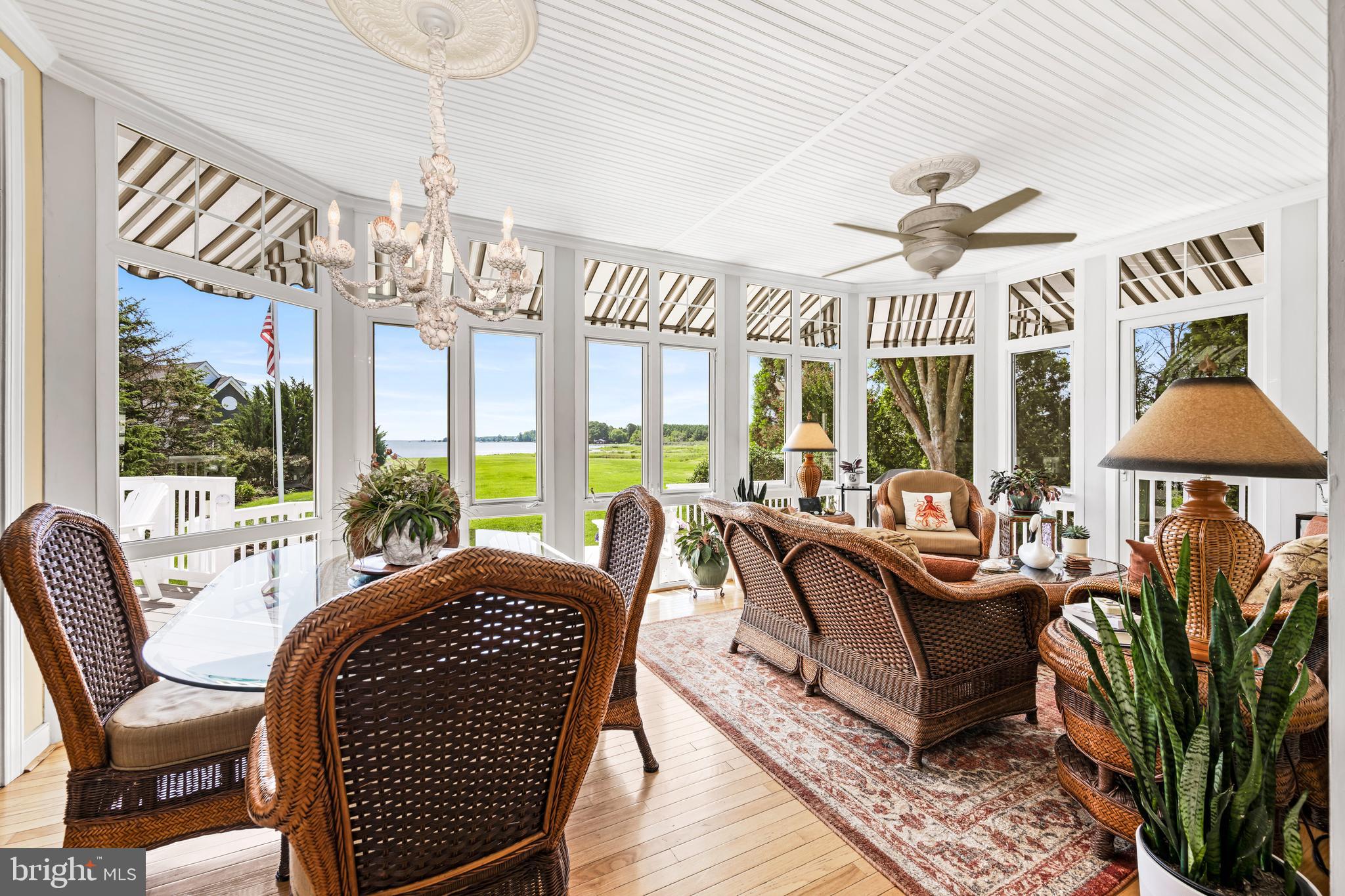 21477 Island Club Road Tilghman, MD 21671 - Photo 27 of 50 a living room with furniture a chandelier and a chandelier
