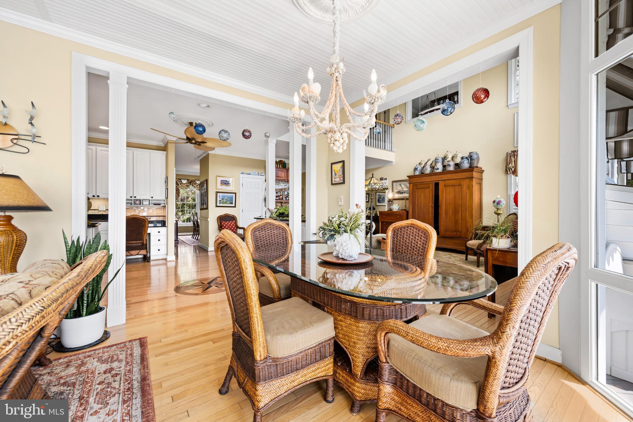 21477 Island Club Road Tilghman, MD 21671 - Photo 29 of 50 a dining room with furniture and chandelier