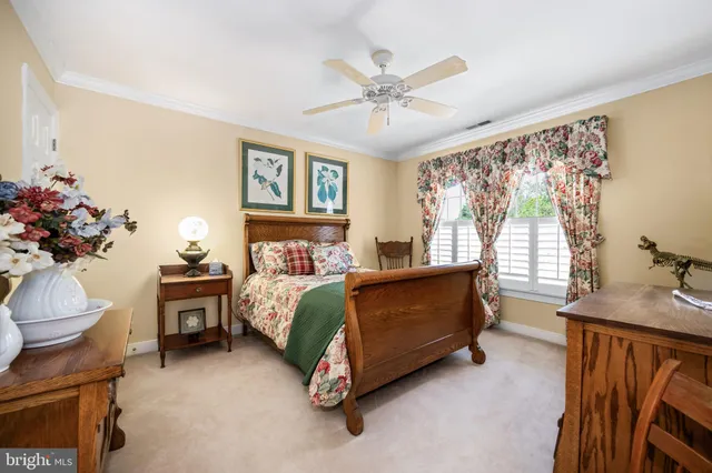 a bed room with a bed and a chandelier
