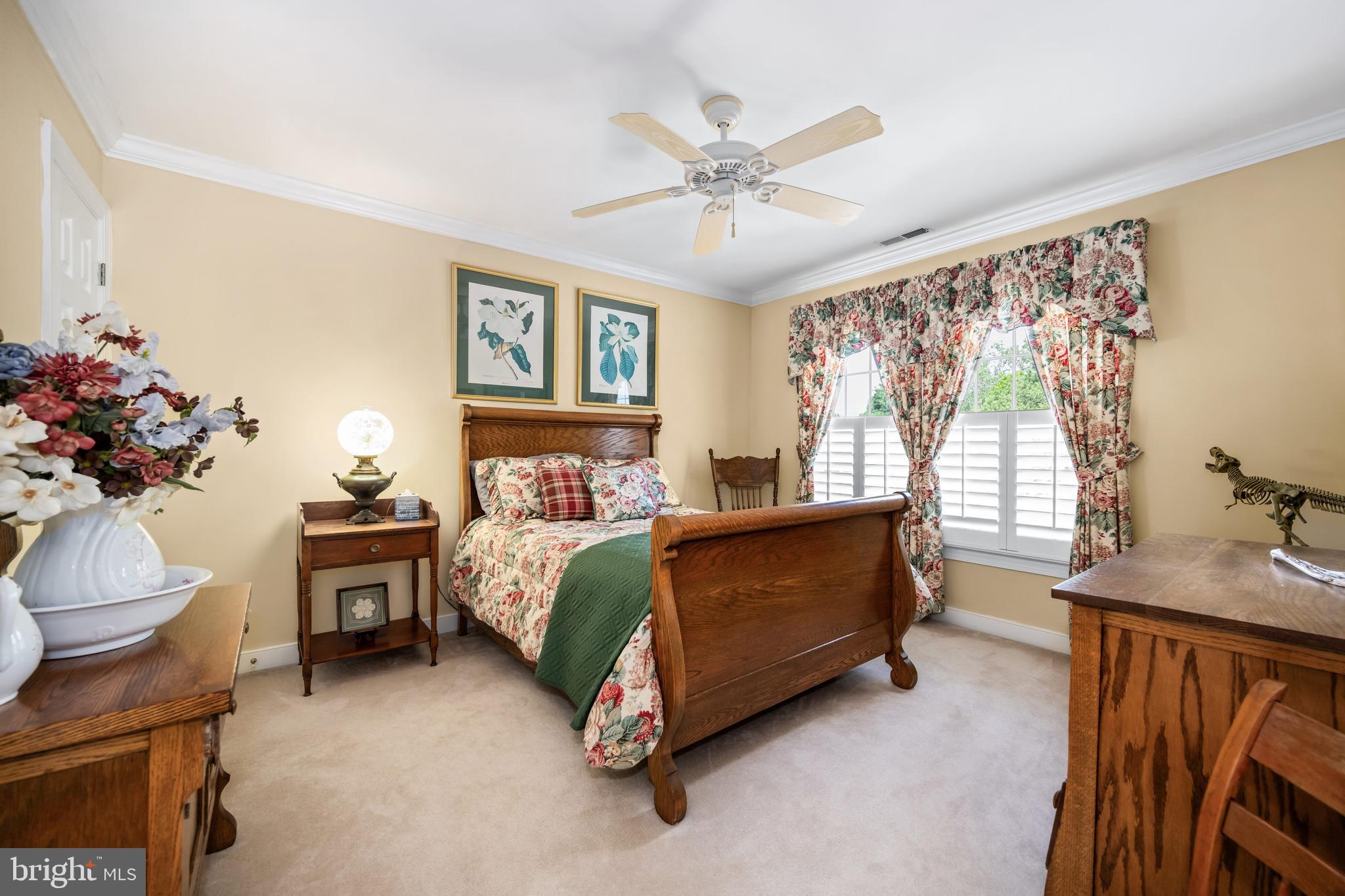 21477 Island Club Road Tilghman, MD 21671 - Photo 36 of 50 a bed room with a bed and a chandelier