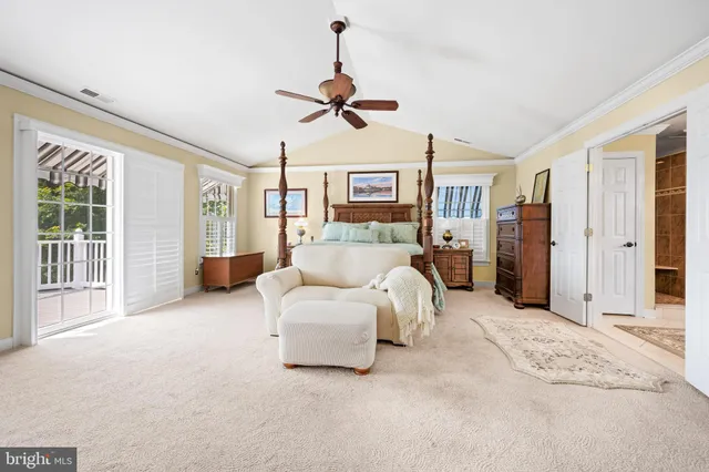 a living room with furniture large window and flat screen tv