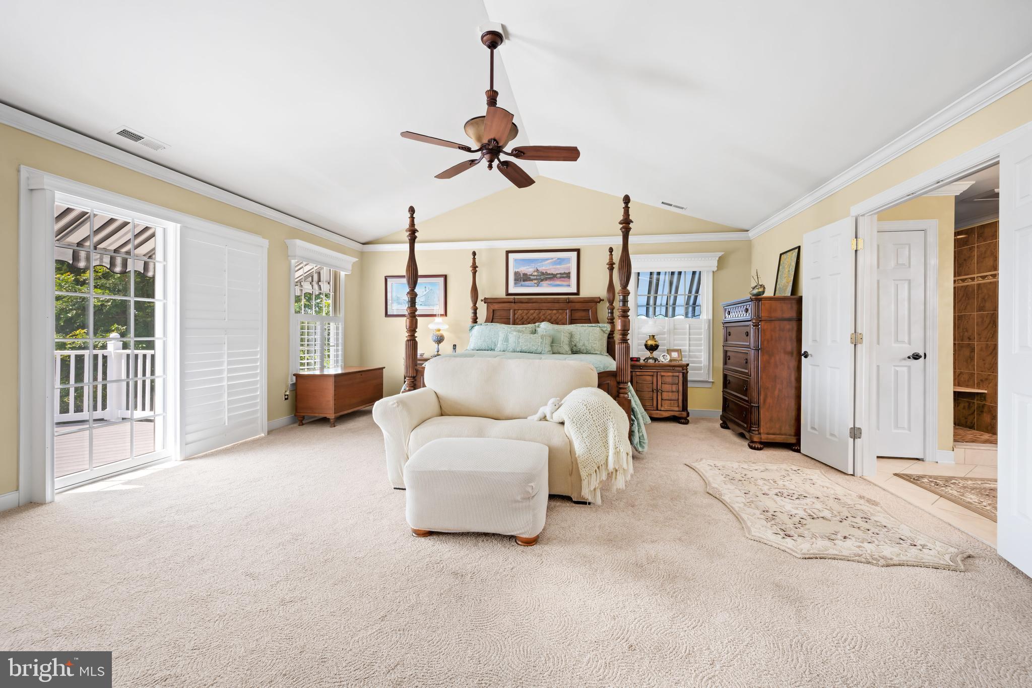 21477 Island Club Road Tilghman, MD 21671 - Photo 39 of 50 a living room with furniture large window and flat screen tv