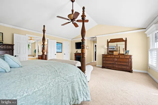 a bed room with a bed and dresser