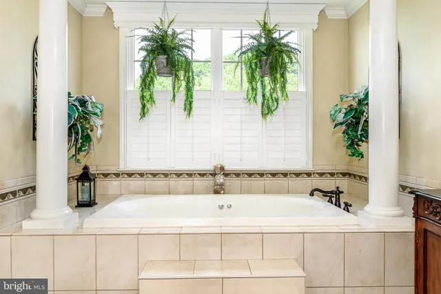 a view of a chair and table in the balcony