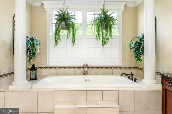 a view of a chair and table in the balcony
