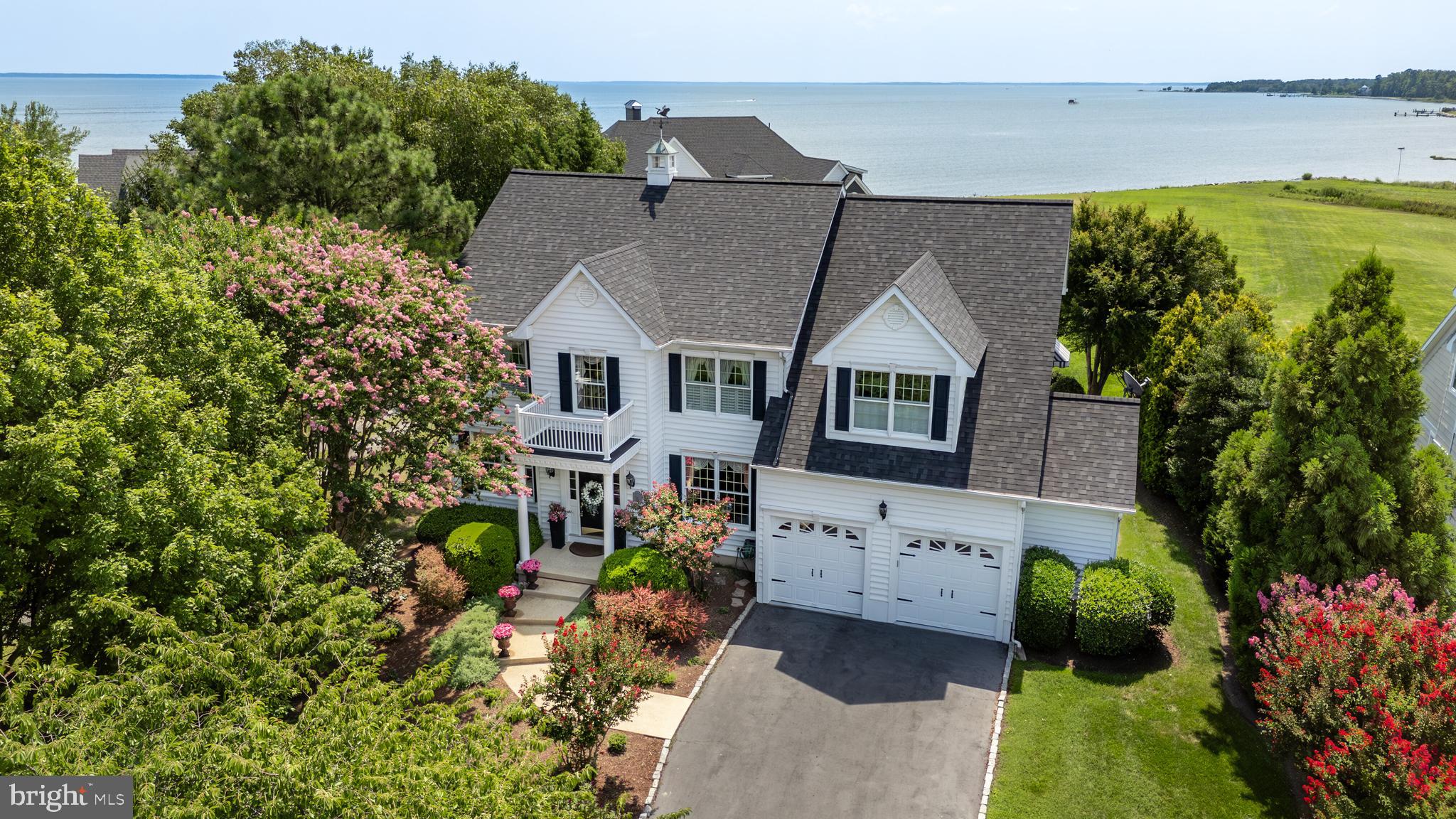 21477 Island Club Road Tilghman, MD 21671 - Photo 9 of 50 a aerial view of a house with a yard and potted plants