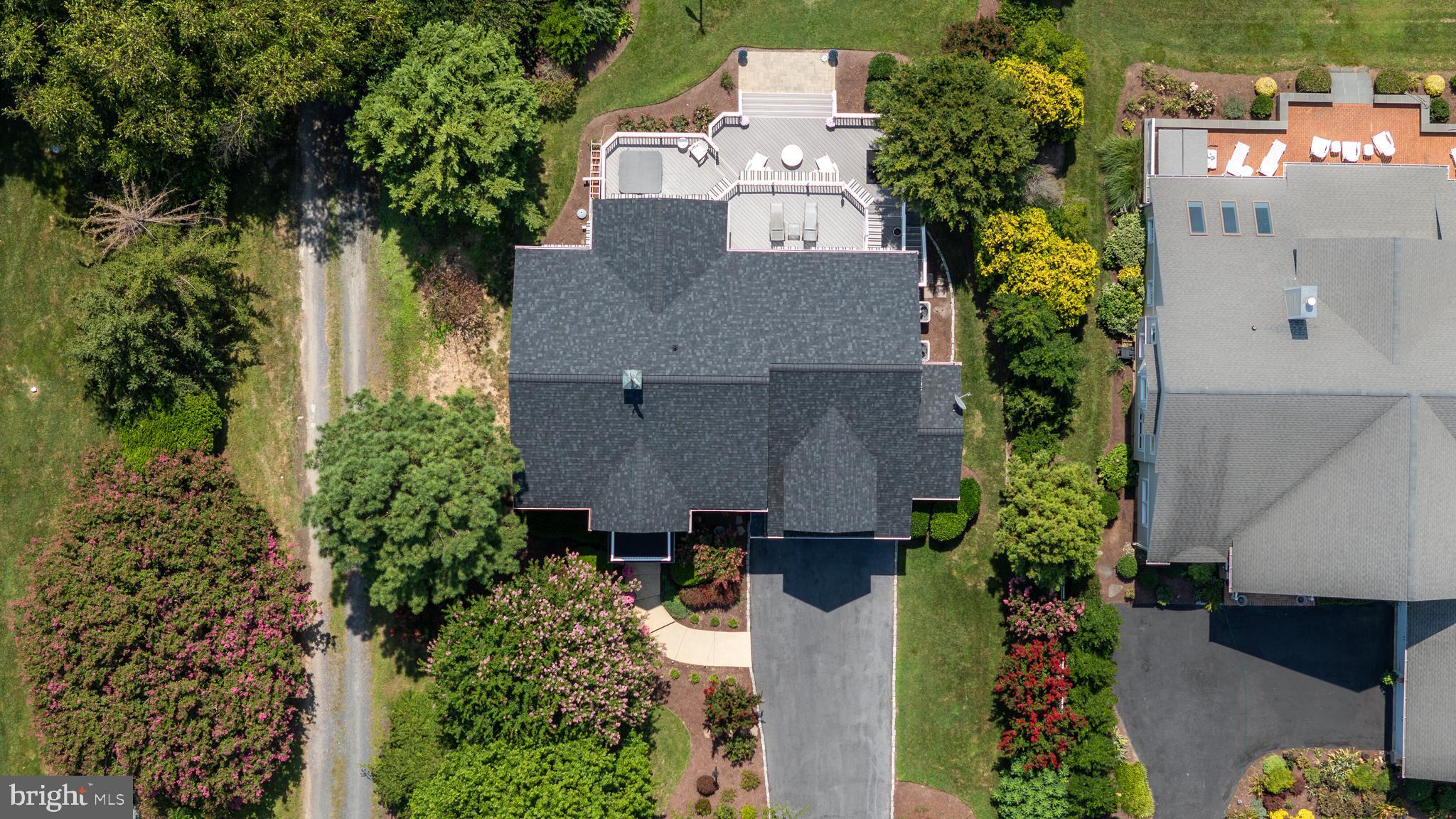 21477 Island Club Road Tilghman, MD 21671 - Photo 10 of 50 an aerial view of a house with a yard and garden