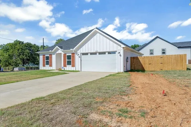 a house view with a garden space