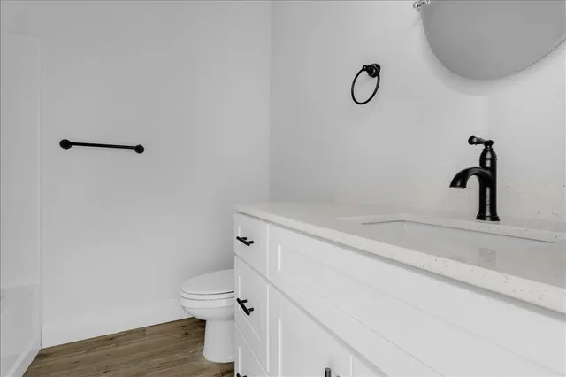 a bathroom with a toilet and a sink