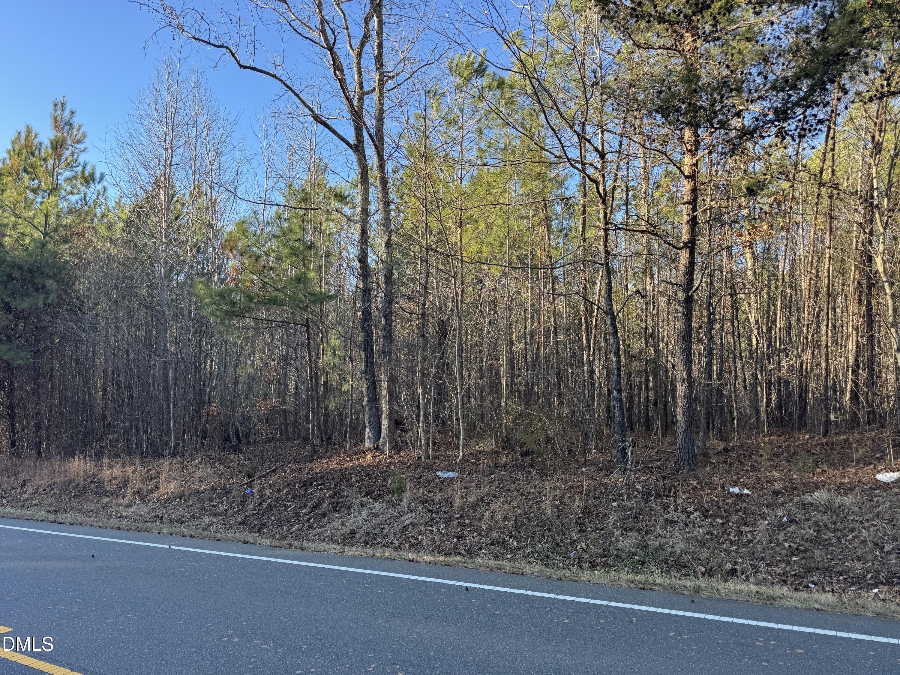 6506 St Marys Road Hillsborough, NC 27278 - Photo 2 of 5 a backyard of a house with lots of green space