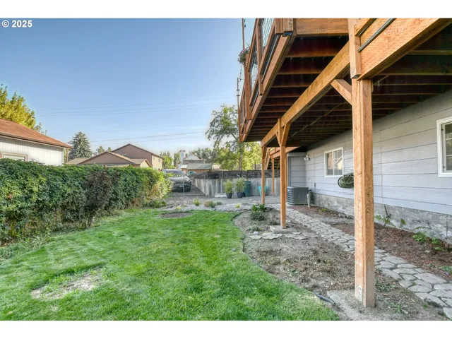 a view of a chairs and table under an umbrella