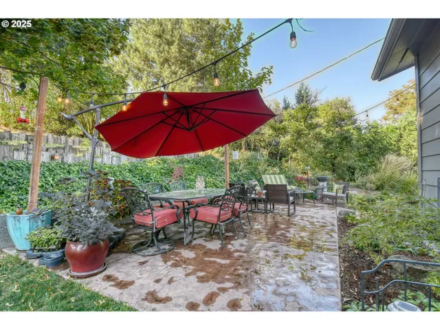 a view of a backyard with sitting area