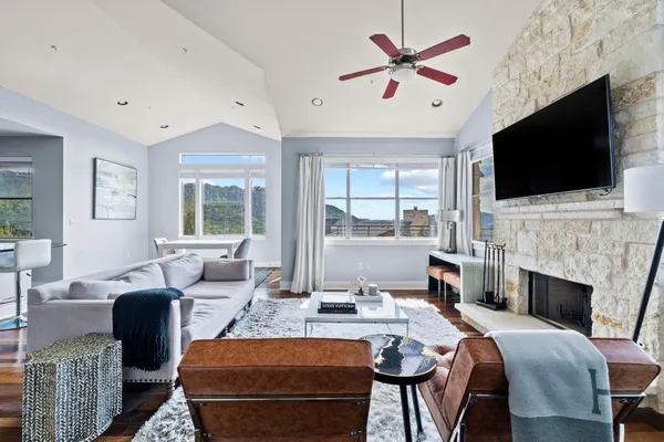 a living room with fireplace furniture and a flat screen tv