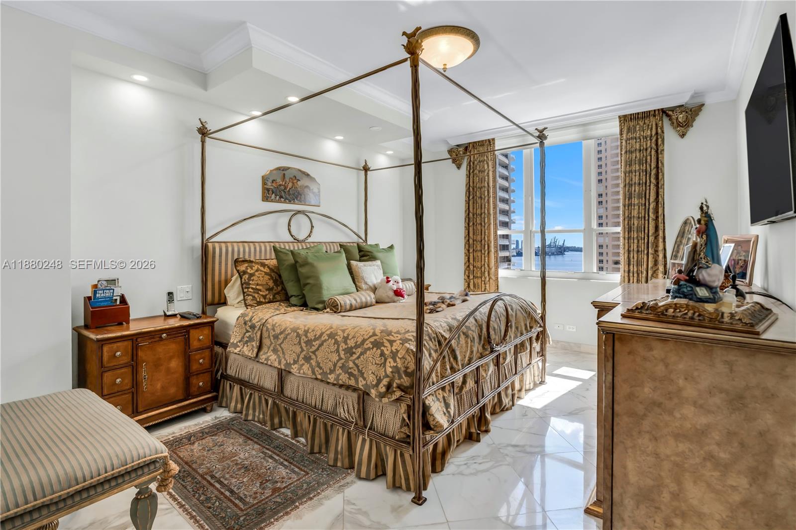 888 Brickell Key Drive, Unit 1807 Miami, FL 33131 - Photo 17 of 58 a bedroom with double bed and a window