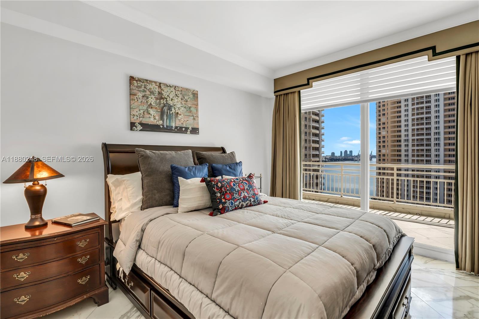 888 Brickell Key Drive, Unit 1807 Miami, FL 33131 - Photo 26 of 58 a bedroom with a bed and window