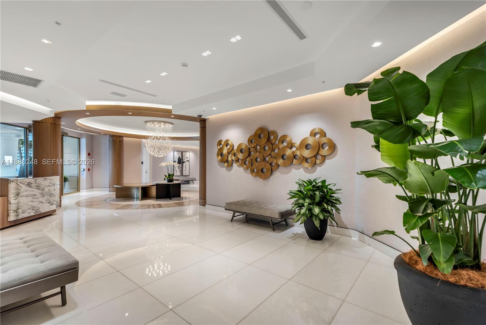 888 Brickell Key Drive, Unit 1807 Miami, FL 33131 - Photo 36 of 58 a view of a lobby with furniture and a potted plant