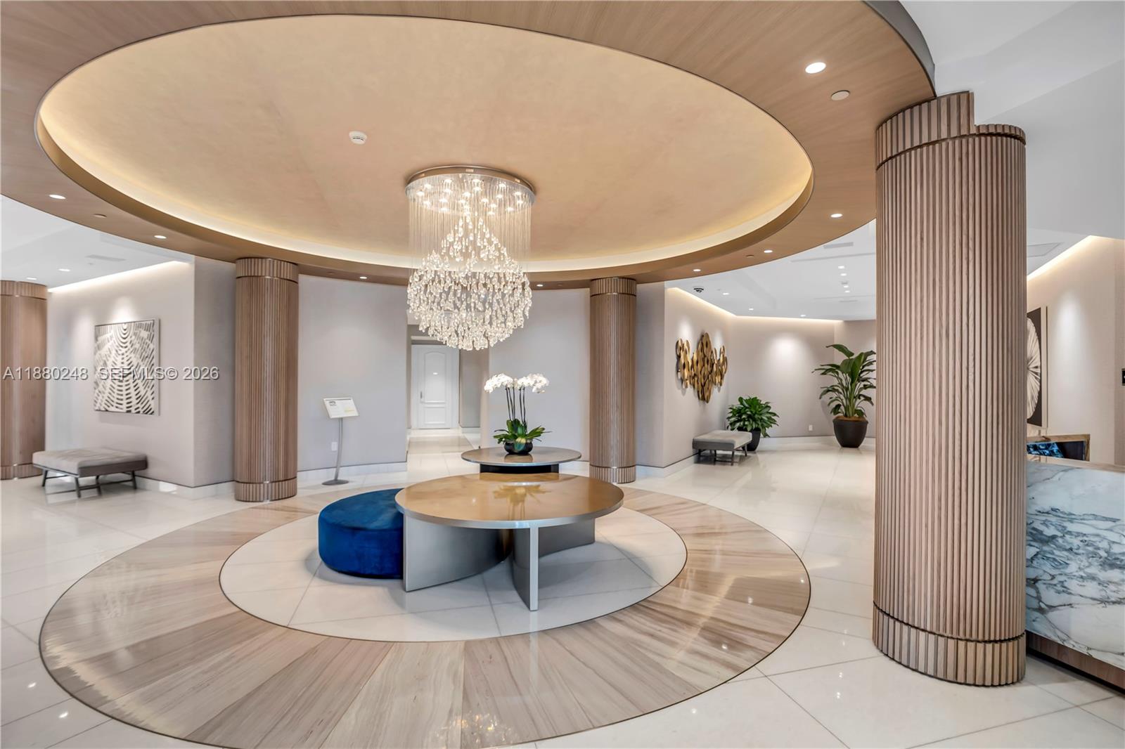 888 Brickell Key Drive, Unit 1807 Miami, FL 33131 - Photo 37 of 58 a lobby with furniture and a chandelier