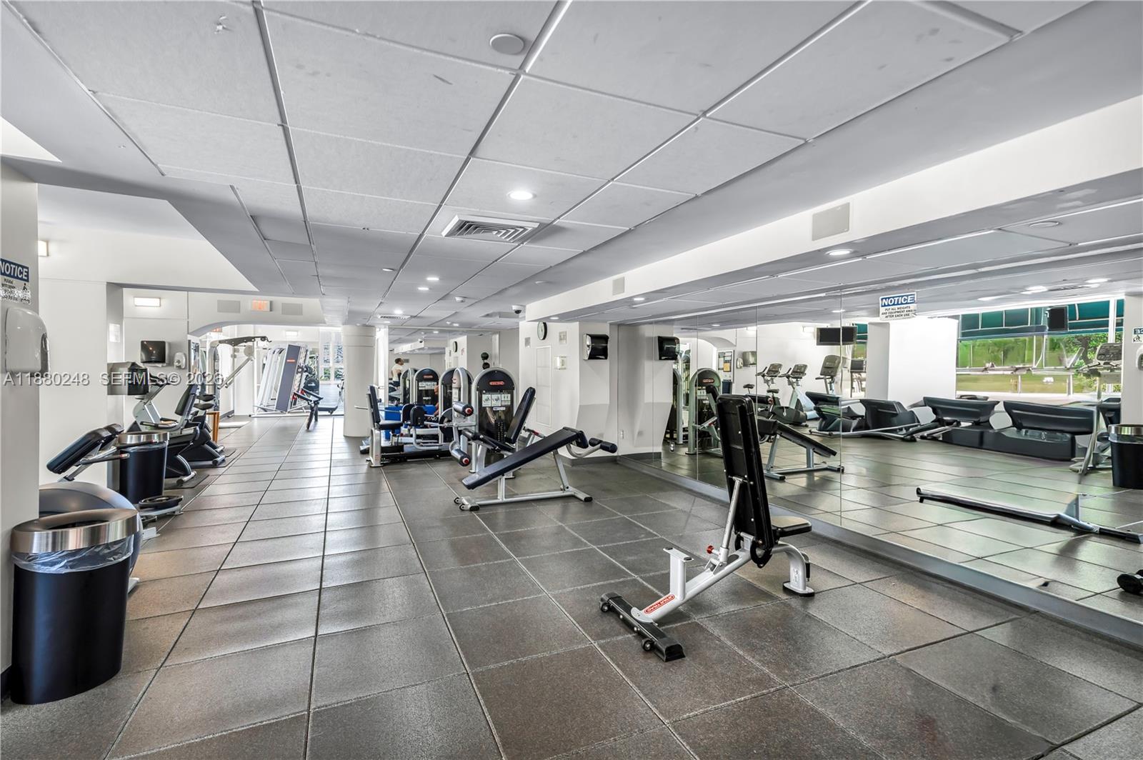 888 Brickell Key Drive, Unit 1807 Miami, FL 33131 - Photo 42 of 58 a view of a room with gym equipment
