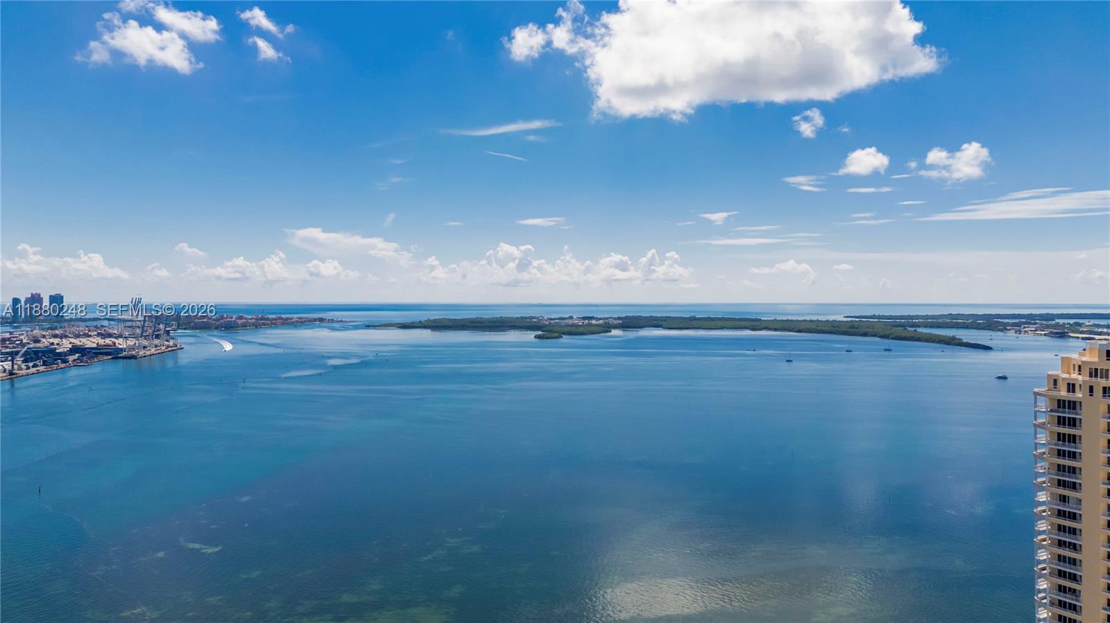 888 Brickell Key Drive, Unit 1807 Miami, FL 33131 - Photo 49 of 58 a view of an ocean and a yard