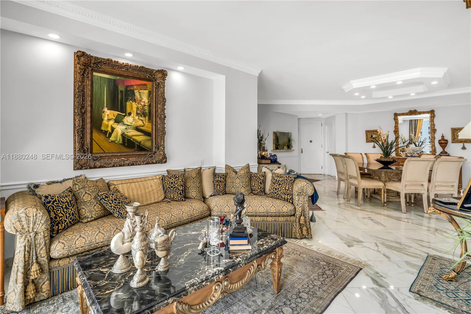 888 Brickell Key Drive, Unit 1807 Miami, FL 33131 - Photo 7 of 58 a living room with furniture and a painting on the wall