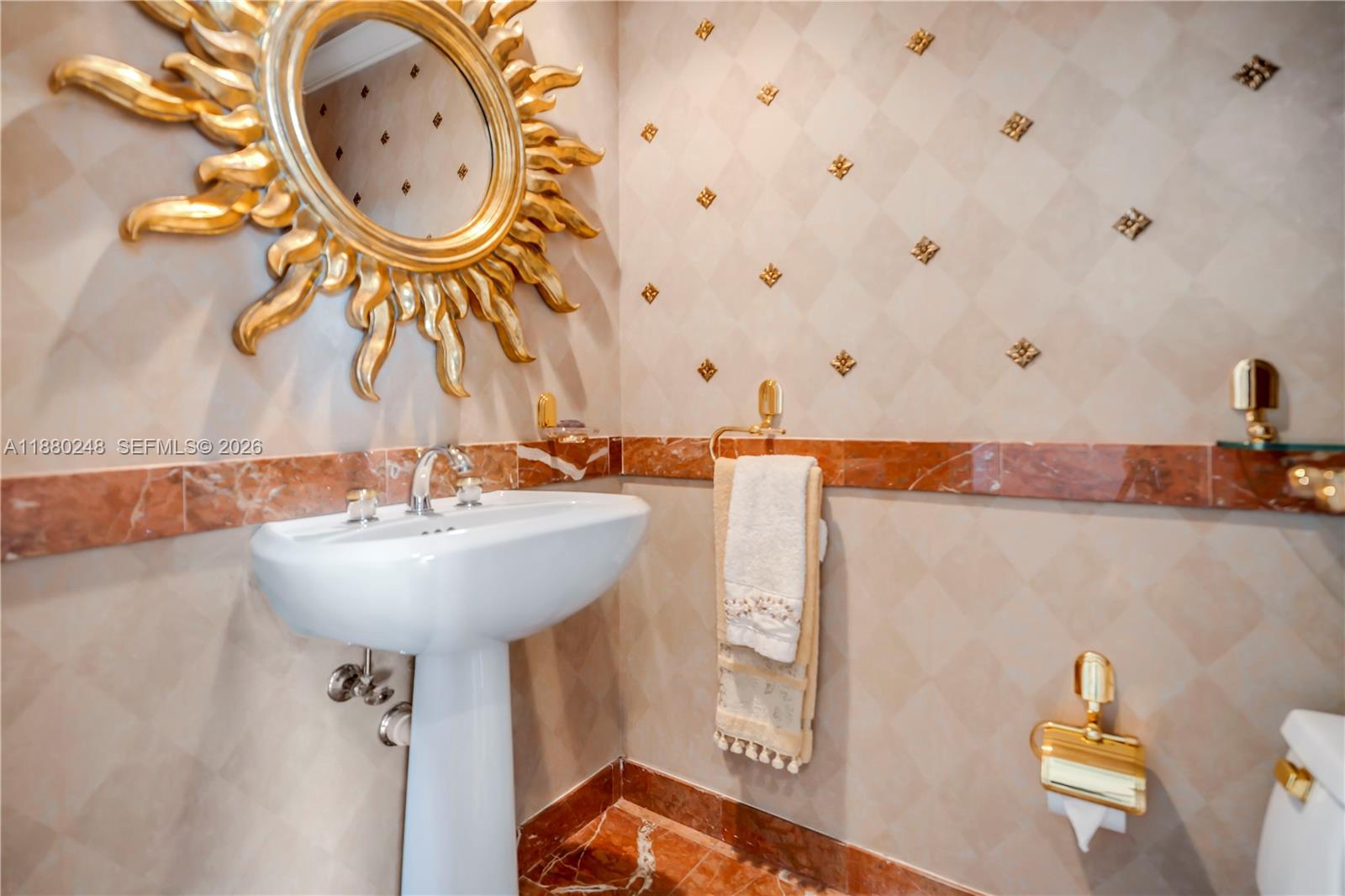 888 Brickell Key Drive, Unit 1807 Miami, FL 33131 - Photo 10 of 58 a bathroom with a sink and a mirror