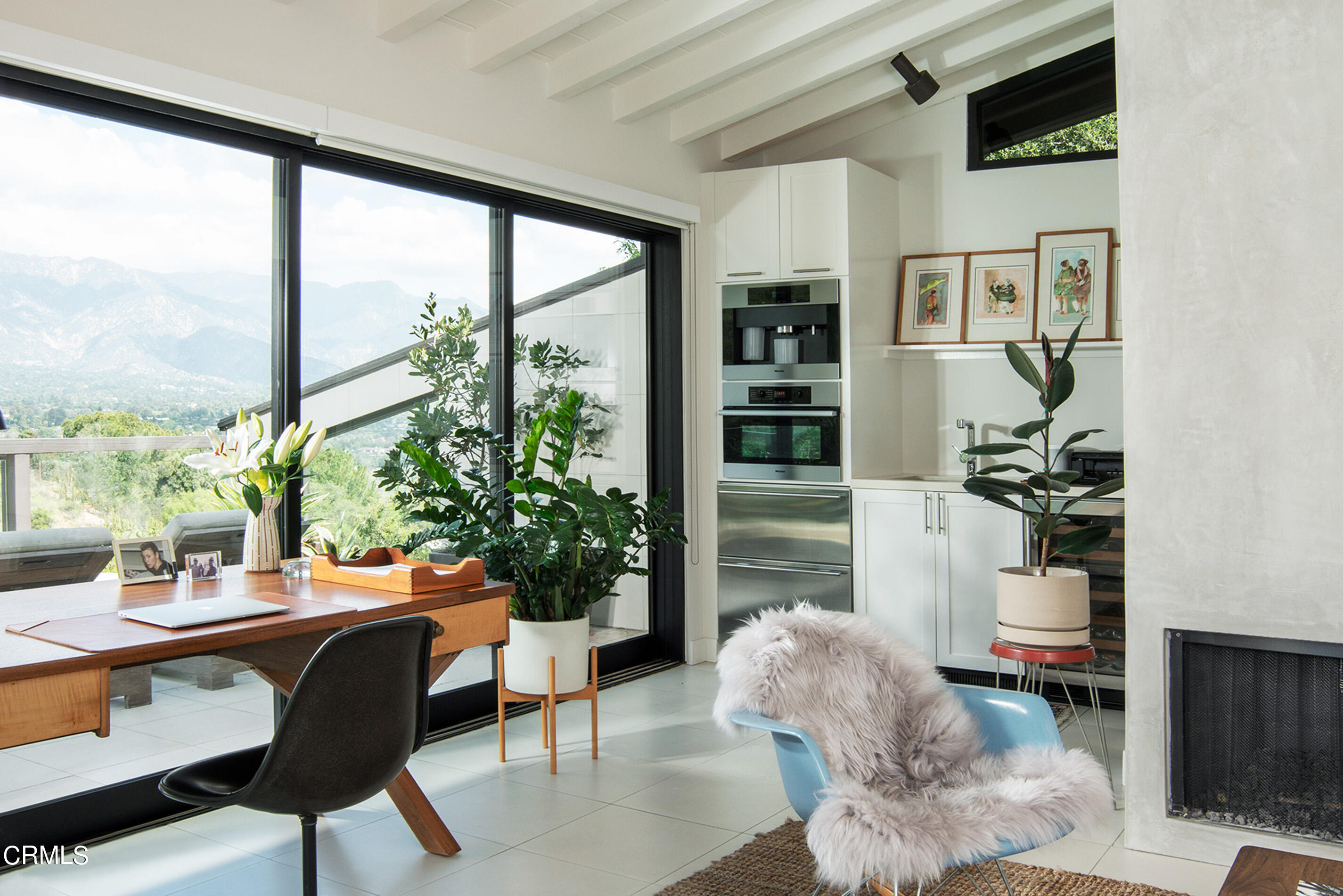 1255 Rancheros Road Pasadena, CA 91103 - Photo 7 of 10 a living room with furniture and a potted plant