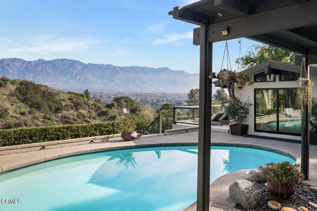 1255 Rancheros Road Pasadena, CA 91103 - Photo 8 of 10 a view of a swimming pool with a patio