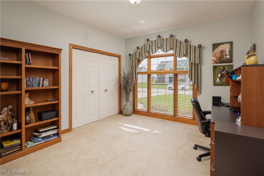 5671 Birmingham Road Northeast Canton, OH 44721 - Photo 14 of 26 Bedroom 3 has lots of natural light and is currently being used as an office.