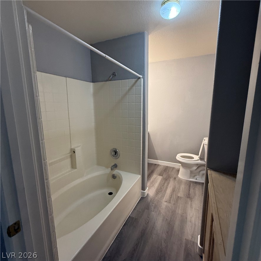 1830 North Pecos Road, Unit 258 Las Vegas, NV 89115 - Photo 7 of 14 A well-appointed bathroom offers practical laminate flooring and a comfortable tub/shower combination.