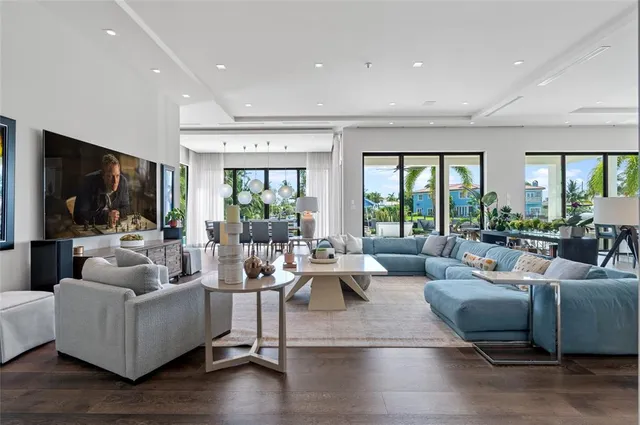 a living room with fireplace furniture and a flat screen tv